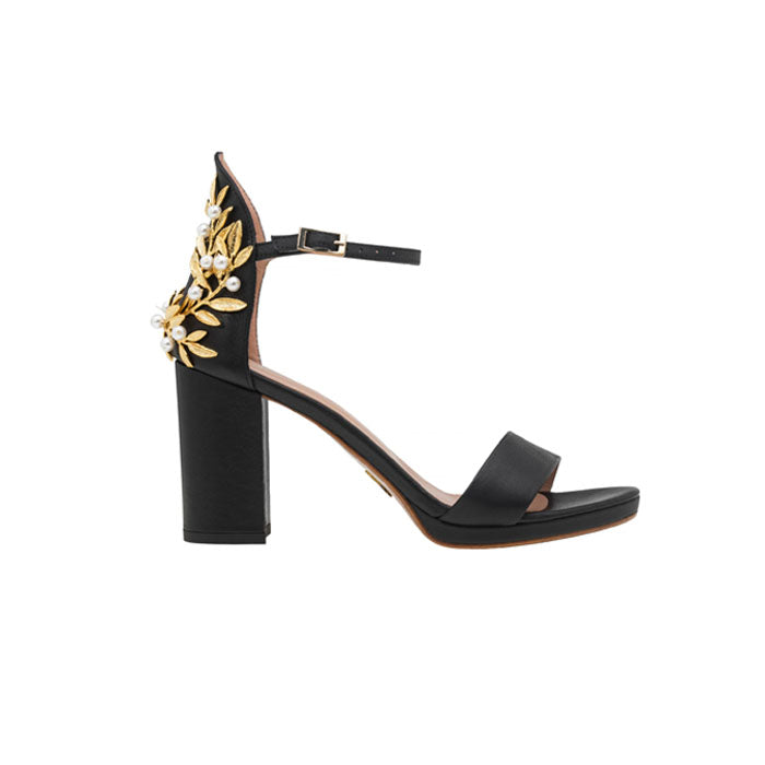 9 cm Black Italian leather open toe sandals with adjustable ankle strap with gold-plated buckle and Brass, Pearl Swarovski ornament on the back.